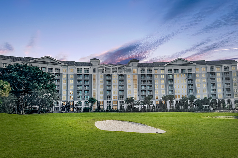 Community exterior overlooking golf course with dusk sky