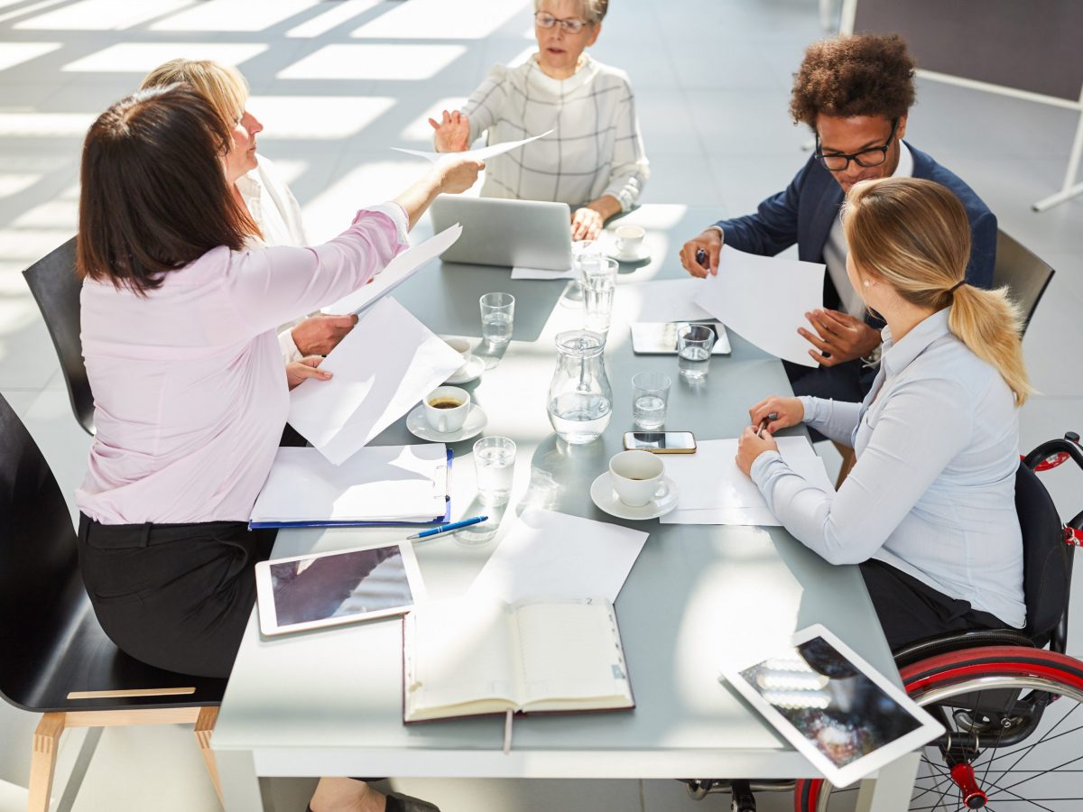Business,People,With,Woman,In,Wheelchair,At,Meeting,For,Project Business,People,With,Woman,In,Wheelchair,At,Meeting,For,Project